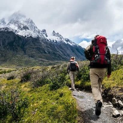 a group of people hiking in the mountains