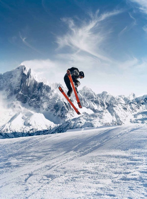 a person jumping in the air with skis