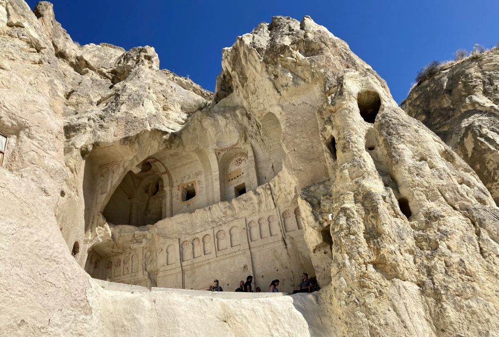 a rock formation with carved walls