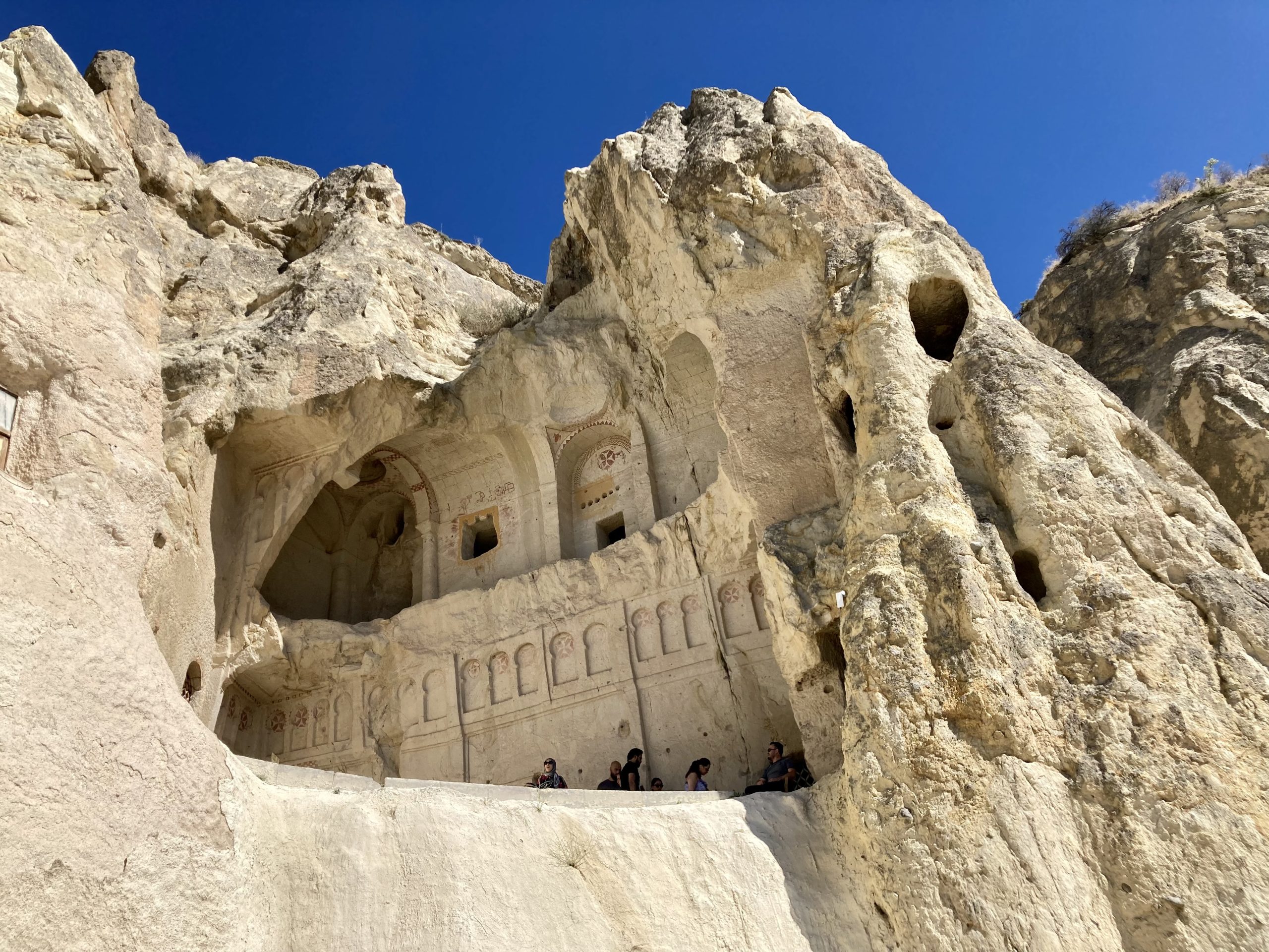 a rock formation with carved walls