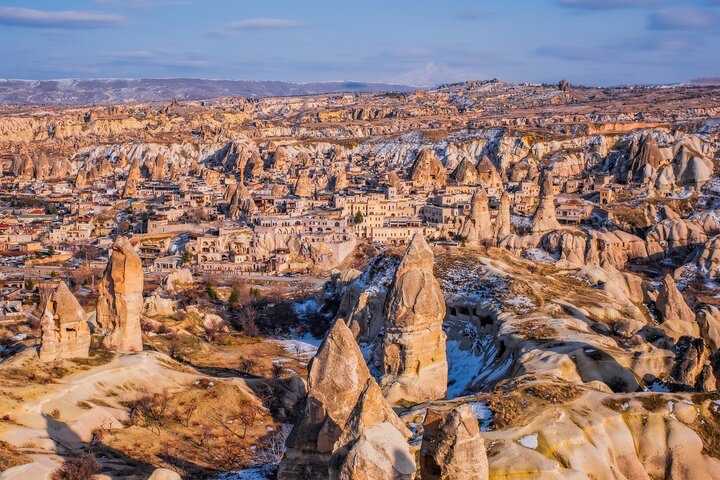 a landscape with a city and mountains