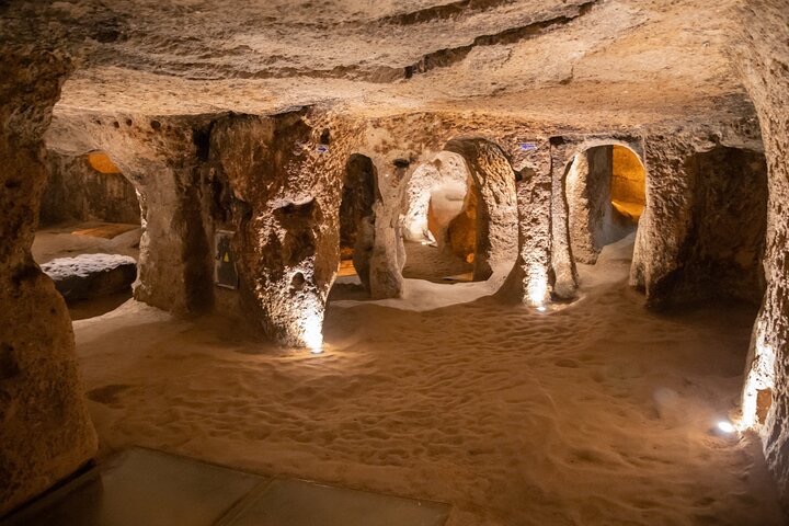 a cave with many holes and lights